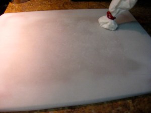 Parchment paper and cornstarch puff.